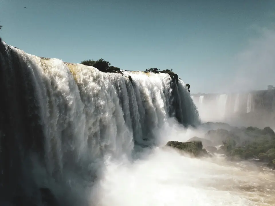 waterfalls under blue sky during daytime — Foz do Iguaçu