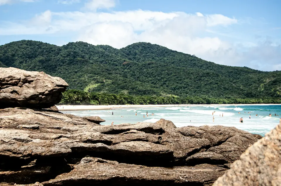 brown rock formation near body of water during daytime — Ilha Grande