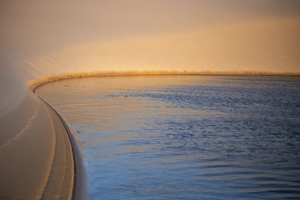 body of water during sunset — Lençóis Maranhenses