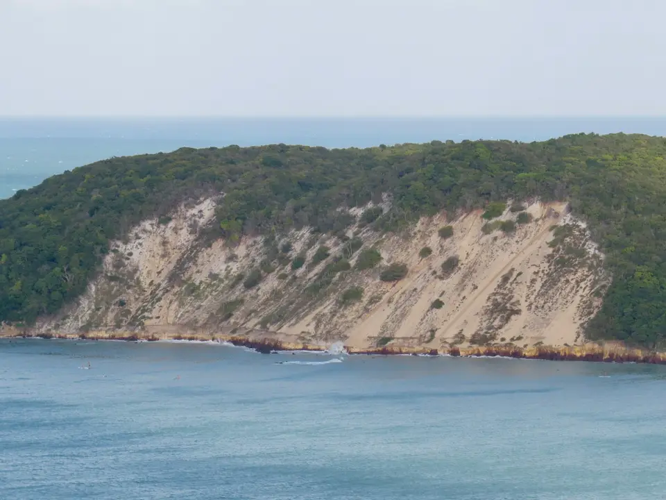 green and brown mountain beside blue sea during daytime — Natal