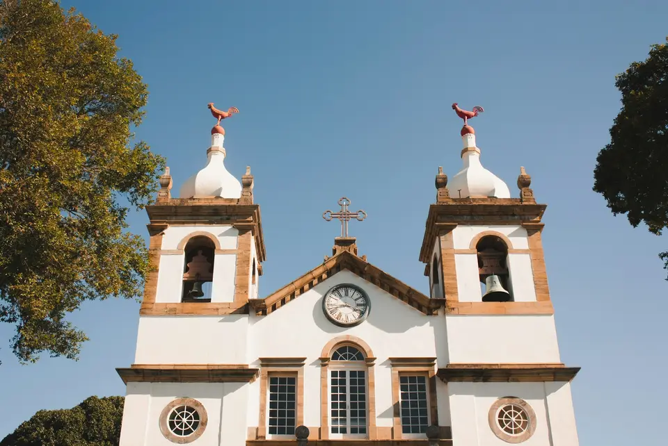 a church with two bell towers and a clock — Paraty