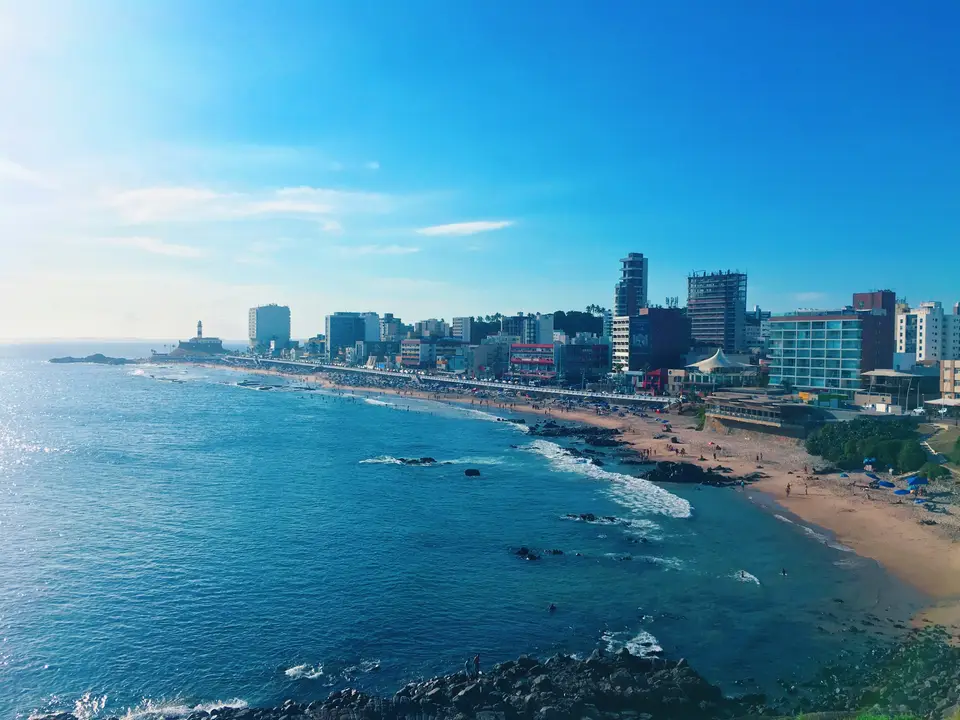 city skyline across body of water during daytime — Salvador
