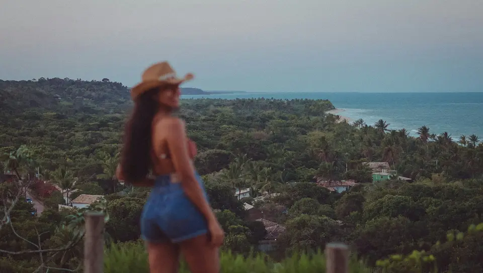 a man that is standing in the grass — Trancoso